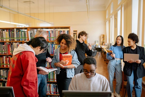 A group of biochemistry students visit library to find some notes and books for their biochemistry homework and assignment