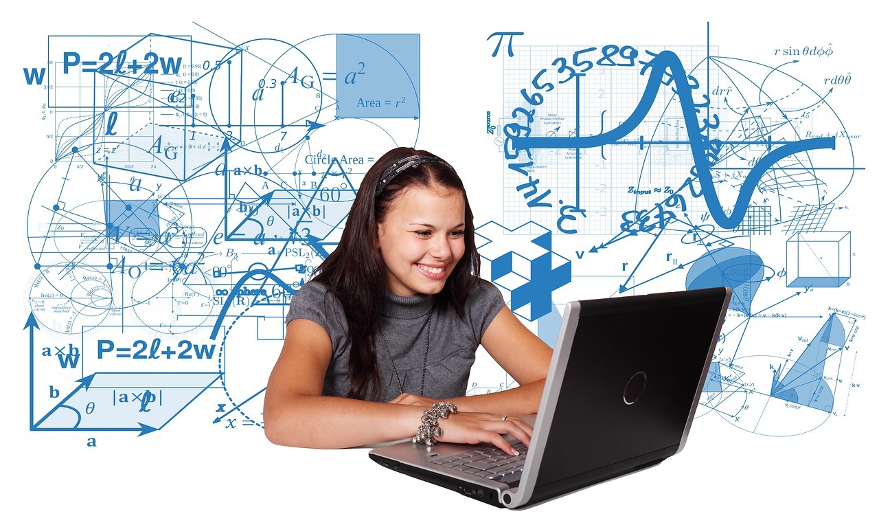 A girl sits at a desk, smiling while using a laptop. Behind her, illustrations of mathematical equations, graphs, formulas, and geometric shapes are visible, suggesting a focus on studying or working on mathematics and physics topics.